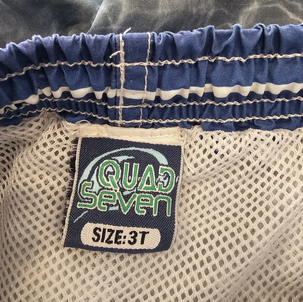3T Quad Seven blue, gray and white swim trunks Vacation Spring Break beach shore